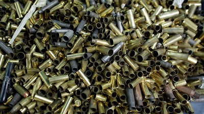 In this Jan. 5, 2016 file photo, empty bullet casings sit in a container at the National Armory gun store and gun range in Pompano Beach, Fla. A U.S. appeals court has upheld a California law that requires new models of semi-automatic handguns to stamp identifying information on bullet casings to help solve crimes. The 9th U.S. Circuit Court of Appeals in a 2-1 decision on Friday, Aug. 3, 2018 said the stamping requirement and two measures intended to make guns safer did not violate the 2nd Amendment.