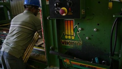 A photo of a worker at Calumet Pallet taken in 2013.