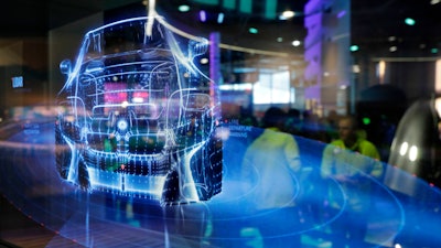 In this Jan. 6, 2017, file photo, a translucent screen shows smart car technology at the Intel booth during CES International in Las Vegas. Already threatened by escalating U.S. taxes on its exports, China is about to find it much harder to invest in U.S. companies and buy American technology in cutting-edge areas such as robotics, artificial intelligence and virtual reality.