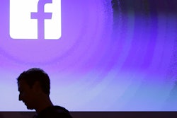 In this April 4, 2013 file photo, Facebook CEO Mark Zuckerberg walks at the company's headquarters in Menlo Park, Calif. Facebook said Tuesday, Aug. 21, 2018, that it had removed 652 pages, groups, and accounts linked to Russia and Iran for “coordinated inauthentic behavior” that included the sharing of political content amid stepped-up policing of its own platform ahead of the U.S. midterm elections in November.