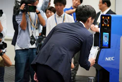 A staff demonstrates a new face recognition system used for the Tokyo 2020 Olympic and Paralympic Games during a press conference in Tokyo Tuesday, Aug. 7, 2018. The NeoFace technology developed by NEC Corp. will be used across the Olympics for the first time as Tokyo organizers work to keep security tight and efficient at dozens of venues during the 2020 Games.
