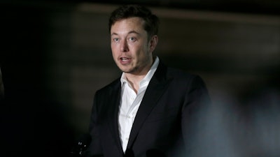 In this June 14, 2018, file photo Tesla CEO and founder of the Boring Company Elon Musk speaks at a news conference in Chicago. Musk says he's in talks with the Saudi Arabian sovereign wealth fund about taking the electric car and solar panel maker private, but no deal has been finalized. Musk says in a blog posted Monday, Aug. 13, that most of the funding would be in stock rather than debt.