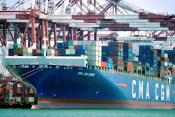 In this July 6, 2018, file photo, a container ship is docked at a port in Qingdao, in eastern China's Shandong Province.