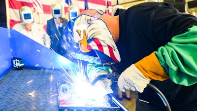 A welder authenticates the keel of LCS 23, the future USS Cooperstown, by welding the initials of keel authenticator Ellen R. Tillapaugh, Mayor of the Village of Cooperstown, New York. The Keel Laying is the formal recognition of the start of the ship's module construction process.