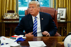 President Donald Trump listens to a question during a meeting with FIFA president Gianni Infantino and United States Soccer Federation president Carlos Cordeiro in the Oval Office of the White House, Tuesday, Aug. 28, 2018, in Washington.