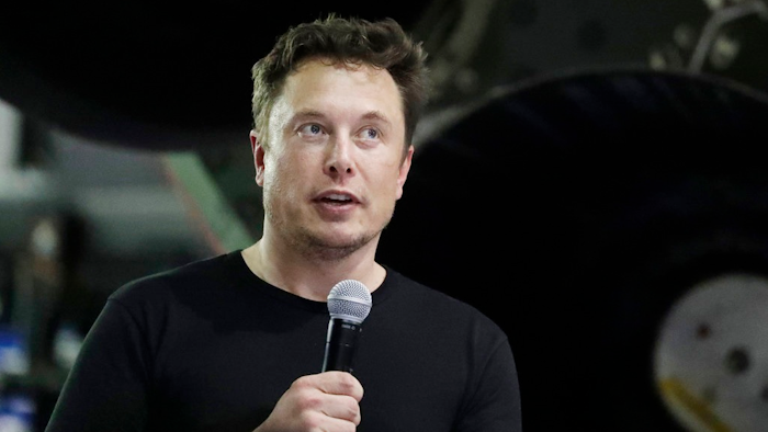 n this Sept. 17, 2018, file photo SpaceX founder and chief executive Elon Musk speaks after announcing Japanese billionaire Yusaku Maezawa as the first private passenger on a trip around the moon in Hawthorne, Calif. U.S. securities regulators have filed a complaint against Musk alleging that he made false and misleading statements about plans to take the company private in August.