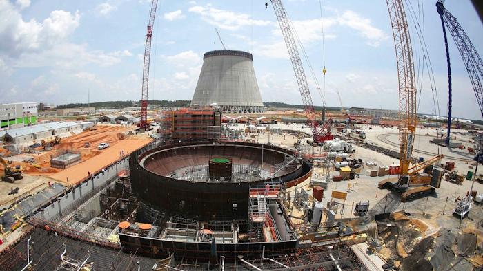 This June 13, 2014, file photo, shows construction on a new nuclear reactor at Plant Vogtle power plant in Waynesboro, Ga. A group of Georgia lawmakers wants a “cost cap” in the construction of a nuclear power plant near Augusta to protect blown budgets from being passed on to consumers. Two reactors being built at Plant Vogtle are billions of dollars over budget.