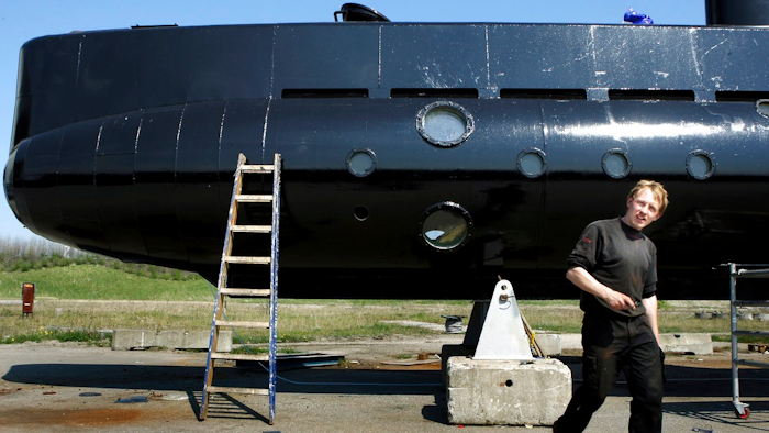 This April 30, 2008 file photo shows a submarine and its owner Peter Madsen. Danish submarine inventor Peter Madsen, who was found guilty of the torture, sexual assault, murder and dismemberment of a Swedish reporter, appeared before an appeals court Wednesday Sept. 5, 2018, to fight against his life sentence.
