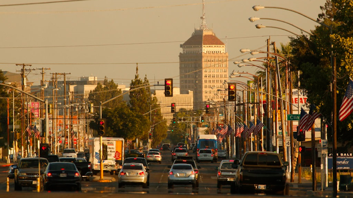 In this June 23, 2017 file photo, cars and trucks roll along a section of Blackstone Avenue during rush hour in Fresno, Calif. Doctors and California officials will be among those weighing in on the Trump administration's proposal to roll back car-mileage standards at a hearing in a region with some of the nation's worst air pollution. The day-long session in Fresno on Monday, Sept. 24, 2018, is the first of three events by the U.S. Environmental Protection Agency and National Highway Traffic Safety Administration to gather public comment on the mileage plan.
