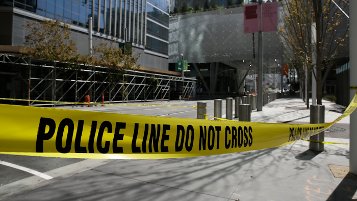 Police tape blocks off Fremont Street outside the closed Salesforce Transit Center Wednesday, Sept. 26, 2018, in San Francisco. A second beam in San Francisco's celebrated new $2 billion transit terminal shows signs of cracking, an official said Wednesday, a day after a crack in a nearby support beam shut down the building that opened just last month. The first crack found by workers installing roof tiles Tuesday spans a beam holding up a park over the three-block-long facility and runs over a downtown street, Salesforce Transit Center executive director Mark Zabaneh said.