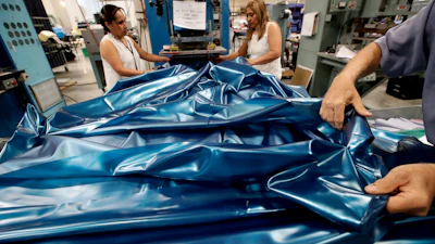 In this July 5, 2018, photo workers assemble the Afloat water bed at the factory in Corona, Calif. Two pioneers of the waterbed industry in the United States, are hoping to generate a new wave of popularity for the old furniture concept by using a wholesome new pitch.