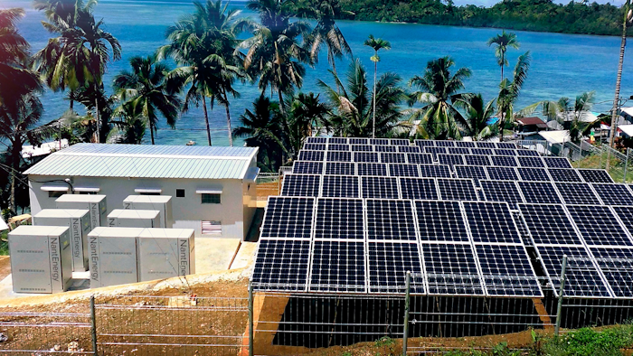 This undated product image provided by NantEnergy shows zinc-air batteries in cabinets at left in a village in Papua, Indonesia. California-based NantEnergy said Wednesday, Sept. 26, 2018, that it has created a rechargeable zinc-air battery storage system that can provide power at a lower cost than lithium-ion systems.