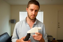 In this May 10, 2013, file photo, Cody Wilson, the founder of Defense Distributed, shows a plastic handgun made on a 3D-printer at his home in Austin, Texas.