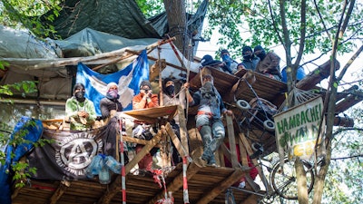 Protesters are seen in their tree house in the Hambach forest in Kerpen, Germany. Thousands of people are protesting against the expansion of a coal strip mine in western Germany that would entail the chopping down of an ancient forest.