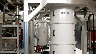 This Feb. 27, 2018, photo shows a quantum computer, encased in a refrigerator that keeps the temperature close to zero kelvin in the quantum computing lab at the IBM Thomas J. Watson Research Center in Yorktown Heights, N.Y. Describing the inner workings of a quantum computer isn’t easy, even for top scholars. That’s because the machines process information at the scale of elementary particles such as electrons and photons, where different laws of physics apply.