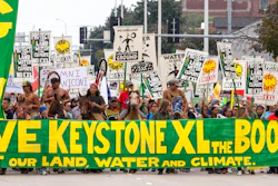 In this Aug. 6, 2017, file photo, demonstrators against the Keystone XL pipeline march in Lincoln, Neb. Civil liberties advocates have sued the U.S government alleging law enforcement agencies are maneuvering to crack down on anticipated protests over the Keystone XL oil pipeline. Attorneys for the American Civil Liberties Union want the court to order the release of all records pertaining to cooperation between federal, state and local law enforcement and private security companies. The suit cites prior efforts to disband protesters opposed to a separate project, the Dakota Access Pipeline.