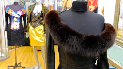 This March 15, 2018, file photo shows a vintage fox trimmed leather dress displayed in the basement of a store in San Francisco. Los Angeles would become the largest city in the U.S. to ban the sale of fur products if the City Council approves a proposed law backed by animal activists who say the multibillion-dollar fur industry is rife with cruelty.