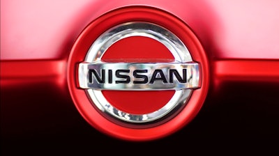 This June 14, 2018, file photo, shows a Nissan logo on a car on display at the automaker's showroom in Tokyo. Nissan is recalling more than 215,000 cars and SUVs due to a fire risk, and the company is advising people to park the vehicles outdoors in rare cases. The recall covers certain 2015 to 2017 Nissan Murano, 2016 and 2017 Nissan Maxima, 2017 through 2018 Nissan Pathfinder and 2017 Infiniti QX60 vehicles.