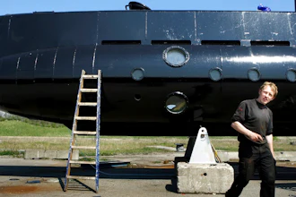 This April 30, 2008 file photo shows a submarine and its owner Peter Madsen. Danish submarine inventor Peter Madsen, who was found guilty of the torture, sexual assault, murder and dismemberment of a Swedish reporter, appeared before an appeals court Wednesday Sept. 5, 2018, to fight against his life sentence.