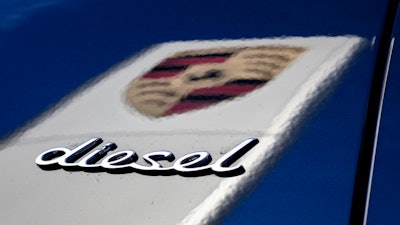 FILE -- In this Wednesday, Nov. 4, 2015 photo the word 'Diesel' and the logo of the German car manufacturer Porsche is pictured in Stuttgart, Germany. Porsche's chief executive Oliver Blum says the sports car maker won't produce any new diesel models in the wake of parent company Volkswagen's diesel emissions scandal.