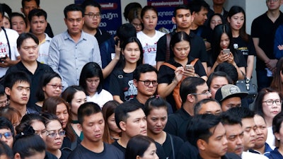 Plaintiffs of Ford cars with bad transmissions gather outside civil court after a verdict in a class-action lawsuit in Bangkok, Thailand, Friday, Sept. 21, 2018. The Thai court has ordered Ford Motor Co. to pay 291 customers a total of around $720,000 in compensation for selling cars equipped with faulty transmissions.