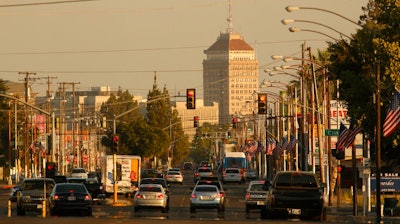 In this June 23, 2017 file photo, cars and trucks roll along a section of Blackstone Avenue during rush hour in Fresno, Calif. Doctors and California officials will be among those weighing in on the Trump administration's proposal to roll back car-mileage standards at a hearing in a region with some of the nation's worst air pollution. The day-long session in Fresno on Monday, Sept. 24, 2018, is the first of three events by the U.S. Environmental Protection Agency and National Highway Traffic Safety Administration to gather public comment on the mileage plan.