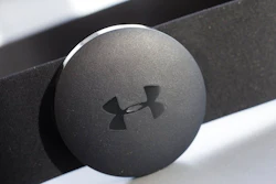 In this Monday, Jan. 4, 2016, file photo, an Under Armour chest strap heart rate monitor is displayed in New York. Under Armour is reducing its global workforce by 3 percent by the end of March, the athletic apparel maker said Thursday, Sept. 20, 2018.