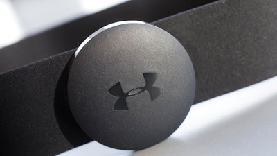 In this Monday, Jan. 4, 2016, file photo, an Under Armour chest strap heart rate monitor is displayed in New York. Under Armour is reducing its global workforce by 3 percent by the end of March, the athletic apparel maker said Thursday, Sept. 20, 2018.