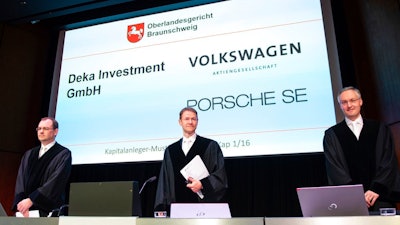 Judges Nicolai Stephan, Christian Jaede and Friedrich Hoffmann, from left, arrive for the opening of a lawsuit against Volkswagen on compensation for the losses of shareholders caused by the Diesel scandal at the higher regional court in Braunschweig, northern Germany, Monday, Sept. 10, 2018.