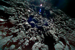This Sept. 23, 2018 image captured by Rover-1B, and provided by the Japan Aerospace Exploration Agency (JAXA) shows the surface of asteroid Ryugu.