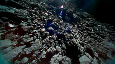 This Sept. 23, 2018 image captured by Rover-1B, and provided by the Japan Aerospace Exploration Agency (JAXA) shows the surface of asteroid Ryugu.