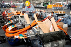 In this Aug. 29, 2018, photo, a man works in an auto parts factory in Liaocheng in eastern China's Shandong province. The Trump administration announced Monday, Sept. 17, 2018, that it will impose tariffs on $200 billion more in Chinese goods starting next week, escalating a trade war between the world's two biggest economies and potentially raising prices on goods ranging from handbags to bicycle tires.