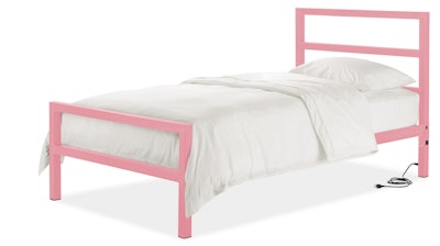 This photo provided by Room & Board shows the Parsons bed, which has ports and plugs on both sides of the headboard. The iron frame comes in a wide range of colors, including some fun ones like red, green, pink, ocean and blue.