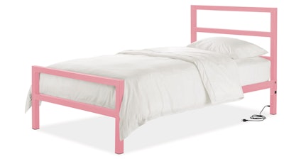 This photo provided by Room & Board shows the Parsons bed, which has ports and plugs on both sides of the headboard. The iron frame comes in a wide range of colors, including some fun ones like red, green, pink, ocean and blue.