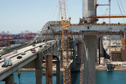 In this July 2, 2018, photo, traffic moves on the old Gerald Desmond Bridge next to its replacement bridge under construction in Long Beach, Calif. The new Gerald Desmond Bridge at the nation’s second-busiest port isn’t just a crucial route for cargo trucks and Southern California commuters - it’s a concrete-and-steel science experiment for engineers and seismologists. It’s slated to open next year.