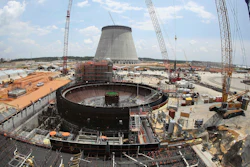 This June 13, 2014, file photo, shows construction on a new nuclear reactor at Plant Vogtle power plant in Waynesboro, Ga. A group of Georgia lawmakers wants a “cost cap” in the construction of a nuclear power plant near Augusta to protect blown budgets from being passed on to consumers. Two reactors being built at Plant Vogtle are billions of dollars over budget.
