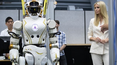 Ivanka Trump looks at a robot during a tour of the Space Vehicle Mockup Facility at NASA's Johnson Space Center on Thursday, Sept. 20, 2018, in Houston.