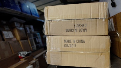 In this May 9, 2017, file photo packages labeled 'Made in China' are loaded on a UPS truck for delivery in New York. Starting Monday, Sept. 17, 2018, the United States is to begin charging a 10 percent tax on thousands of Chinese imports — tires, windshield wipers, baseball gloves, bicycles, snakeskin pants, backpacks, trombone cases, refrigerators and wooden furniture, among others. The list runs 194 pages.