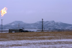 In this Feb. 25, 2015, file photo, a gas flare is seen at a natural gas processing facility near Williston, N.D. The Interior Department on Tuesday, Sept. 18, 2018, finalized the roll back of an Obama-era regulation aimed at restricting harmful methane emissions from oil and gas production on federal lands.