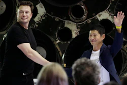 SpaceX founder and chief executive Elon Musk, left, shakes hands with Japanese billionaire Yusaku Maezawa, right, after announcing him as the first private passenger on a trip around the moon, Monday, Sept. 17, 2018, in Hawthorne, Calif.