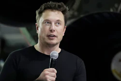 In this Monday, Sept. 17, 2018, file photo Tesla CEO and SpaceX founder and chief executive Elon Musk speaks after announcing Japanese billionaire Yusaku Maezawa as the first private passenger on a trip around the moon in Hawthorne, Calif. Tesla Inc. has turned over documents to the U.S. Justice Department after statements by Musk about taking the company private, the electric car maker confirmed Tuesday, Sept. 18.