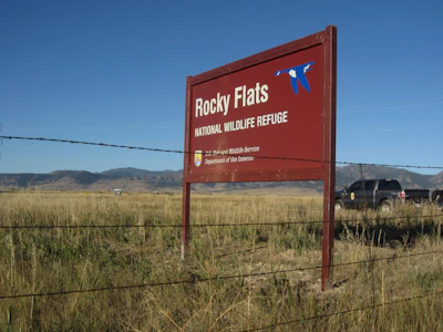 A U.S. Fish and Wildlife Service officer drives into the Rocky Flats National Wildlife Refuge outside Denver on Saturday, Sept. 15, 2018, the first day the refuge was open to the public. The refuge is on the outskirts of a former U.S. government factory that manufactured plutonium triggers for nuclear weapons.