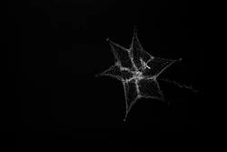 In this September 2018 image made from video provided by the University of Surrey, a net is launched from the International Space Station to catch a test object. The experiment was conducted to research ways to clean up debris in orbit around the Earth.