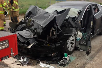 In this May 11, 2018, file photo, released by the South Jordan Police Department shows a traffic collision involving a Tesla Model S sedan with a fire department mechanic truck stopped at a red light in South Jordan, Utah. Heather Lommatzsch, the Utah driver who slammed her Tesla into the stopped firetruck at a red light while using the vehicle's semi-autonomous function, is suing the company.