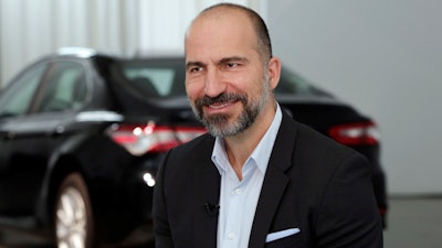 Uber CEO Dara Khosrowshahi listens during an interview after the company's unveiling of the new features in New York, Wednesday, Sept. 5, 2018. Uber is aiming to boost driver and passenger safety in an effort to rebuild trust in the brand.