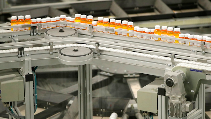 In this July 10, 2018, file photo bottles of medicine ride on a belt at the Express Scripts mail-in pharmacy warehouse in Florence, N.J. On Monday, Oct. 15, the industry's largest trade group announced that dozens of drugmakers will start disclosing the prices for U.S. prescription drugs advertised on TV. The prices won't actually be shown in the TV commercials but the advertisement will include a website where the list price will be posted.