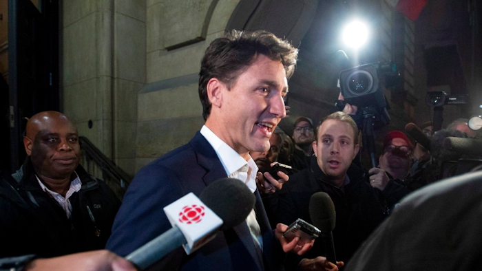 Prime Minister Justin Trudeau leaves the Office of the Prime Minister and Privy Council after an agreement was reached in the NAFTA negotiations in Ottawa, Ontario, Sunday, Sept. 30, 2018. The U.S. and Canada reached the basis of a free trade deal Sunday night, a senior Canadian government official said.