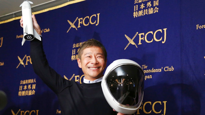 Zozo Chief Executive Yusaku Maezawa poses for the media prior to his news conference in Tokyo, Tuesday, Oct. 9, 2018. The Japanese online retail tycoon who plans to travel to the moon on the SpaceX rocket says he respects and trusts Elon Musk as a fellow entrepreneur, despite his recent troubles.
