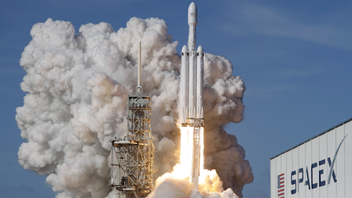 A Falcon 9 SpaceX heavy rocket lifts off from pad 39A at the Kennedy Space Center in Cape Canaveral, Fla., Feb. 6, 2018.