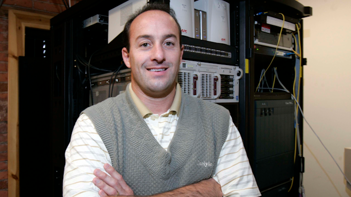 In this Oct. 13, 2005, photo Jeffrey Ansted, founder of American Broadband and Telecommunications, poses for a photo. The Federal Communications Commission accused Toledo-based American Broadband and Telecommunications Co. of creating fake accounts by using the identities of dead people and manipulating the information from existing customers to get government reimbursements. The company's founder, Ansted, used the money to buy country club memberships, a Ferrari convertible, a Florida condominium and an $8 million Cessna jet, the FCC said.